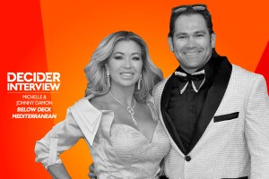 Johnny Damon and wife Michelle in black and white on a bright orange background