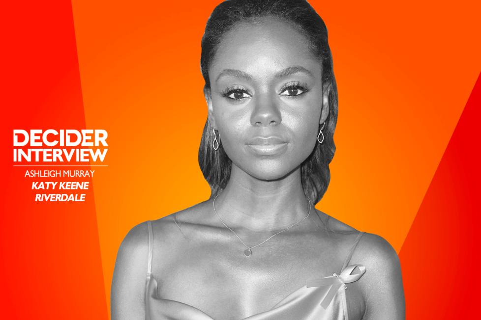 Ashleigh Murray in black and white on a bright orange background