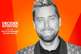 Lance Bass in black and white on a bright orange background