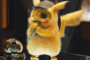 Pikachu holds a magnifying glass in Pokemon Detective Pikachu