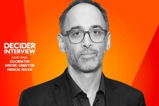 DAVID WAIN in black and white on a bright orange background