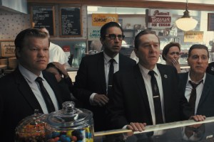 (From l to r) During a break in the trial of Jimmy Hoffa, Chuckie O’Brien (Jesse Plemons), Bill Bufalino (Ray Romano), Frank Sheeran (Robert De Niro) and Hoffa (Al Pacino) are shocked at the news of JFK’s assassination. © 2019 Netlfix US, LLC. All rights reserved.