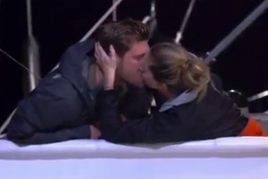 Chef Adam Glick and chief stew Jenna MacGillivray kiss on Below Deck Sailing Yacht