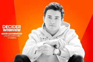 Gavin Leatherwood in black and white on a bright orange background