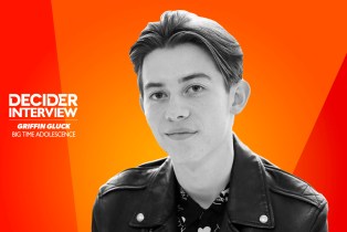 Griffin Gluck of Big Time Adolescence in black and white on a bright orange background