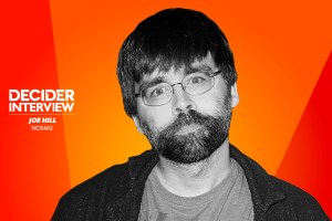 Joe Hill in black and white on a bright orange background