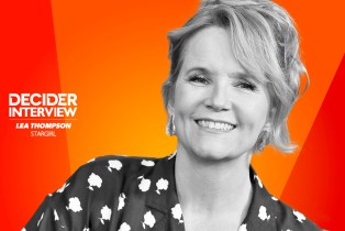Lea Thompson in black and white on a bright orange background