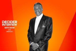 KEITH DAVID in black and white on a bright orange background
