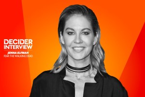 Jenna Elfman in black and white on a bright orange background