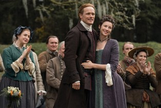 OUTLANDER, from left: Caitlin O'Ryan, Sam Heughan, Caitriona Balfe, ‘The Fiery Cross', (Season 5, Episode 501, aired Feb. 16, 2020).