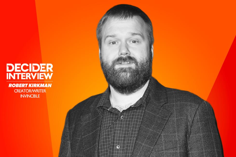 Robert Kirkman in black and white on a bright orange background