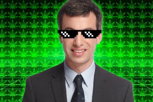 Nathan Fielder wearing sunglasses and against a background of weed