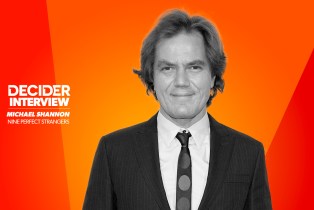 Michael Shannon in black and white on a bright orange background