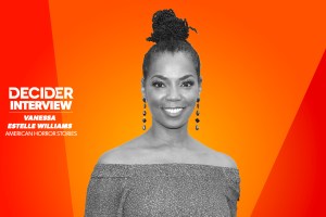 Vanessa Estelle Williams in black and white on a bright orange background