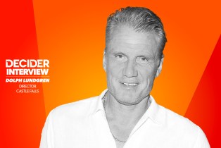 DOLPH LUNDGREN in black and white in front of a bright orange background