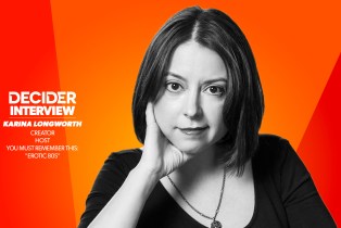 KARINA LONGWORTH in black and white in front of a bright orange background