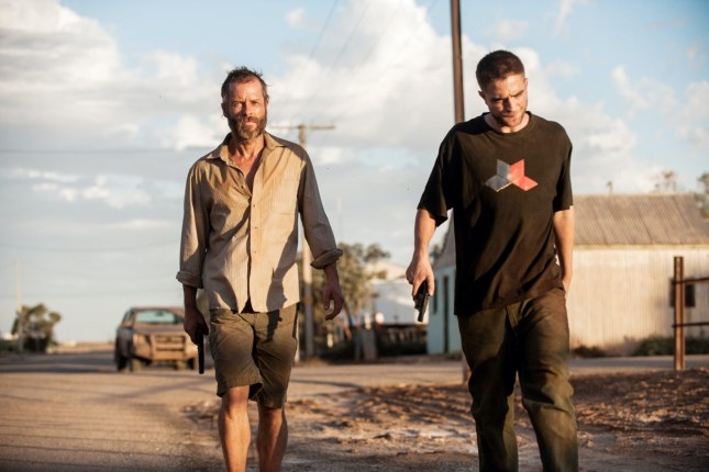 THE ROVER, from left: Guy Pearce, Robert Pattinson, 2014. ph: Matt Nettheim/©A24/Courtesy Everett