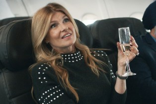 Connie Britton holding a glass of champagne on a plane as Dee Dee in 'Dear Edward'