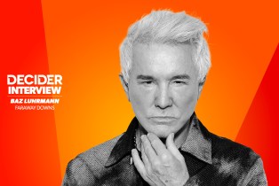 Baz Luhrmann in black and white on a bright orange background