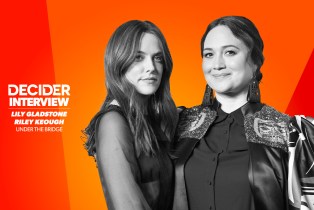 Lily Gladstone and Riley Keough in black and white on a bright orange background