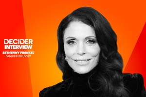 Bethenny Frankel in black and white on a bright orange background