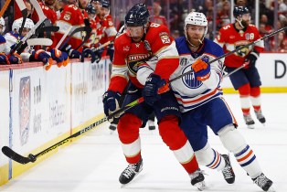 SUNRISE, FLORIDA - JUNE 18: Kyle Okposo #8 of the Florida Panthers tangles with Connor McDavid #97 of the Edmonton Oilers in Game Five of the Stanley Cup Final at the Amerant Bank Arena on June 18, 2024 in Sunrise, Florida. (Photo by Eliot J. Schechter/NHLI via Getty Images)