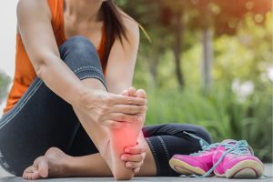 Woman suffering from foot pain