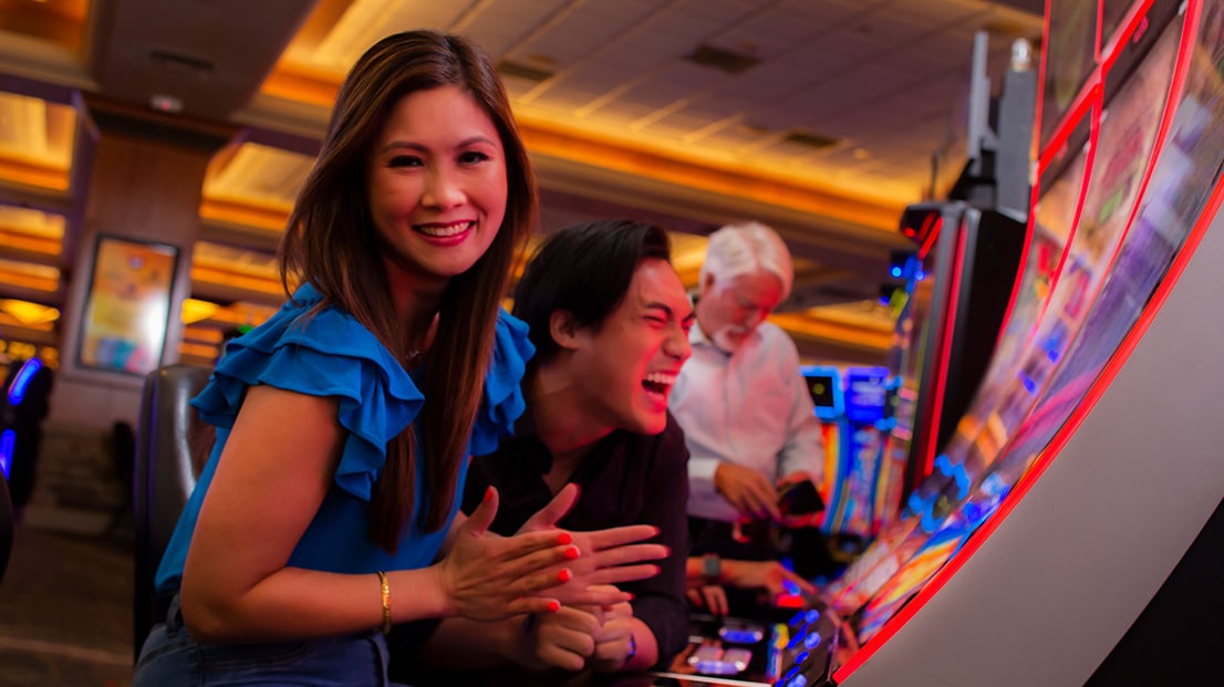 Woman playing a slot machine