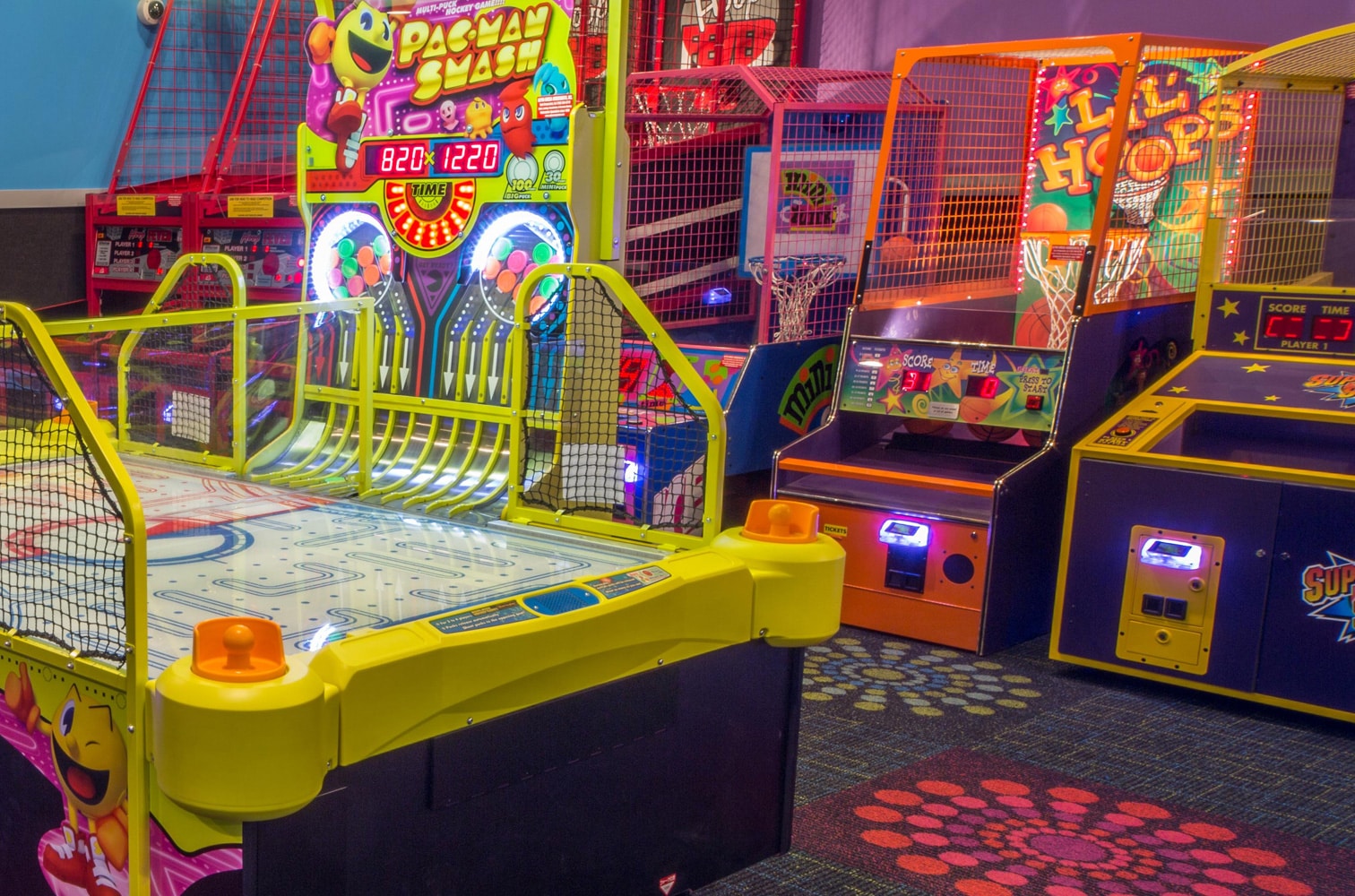 Photo of Cyber Quest Arcade with air hockey table and basketball shooting game