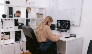 Office with person working at desk.