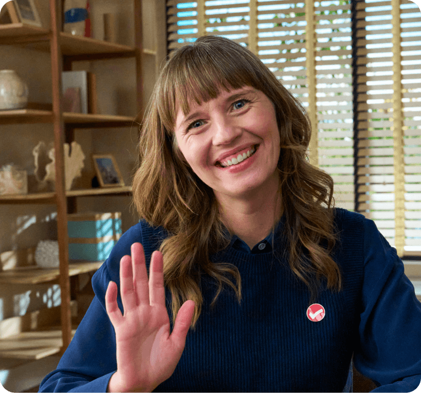 TurboTax expert waving and smiling