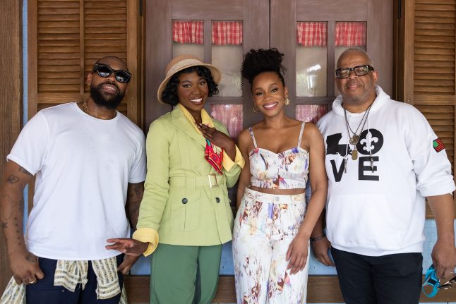 PJ Morton, Anika Noni Rose and Terence Blanchard smile with Princess Tiana