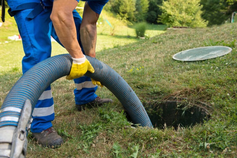 Emptying household septic tank. Cleaning sludge from septic system.