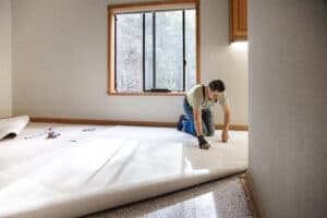 Man installing new carpet