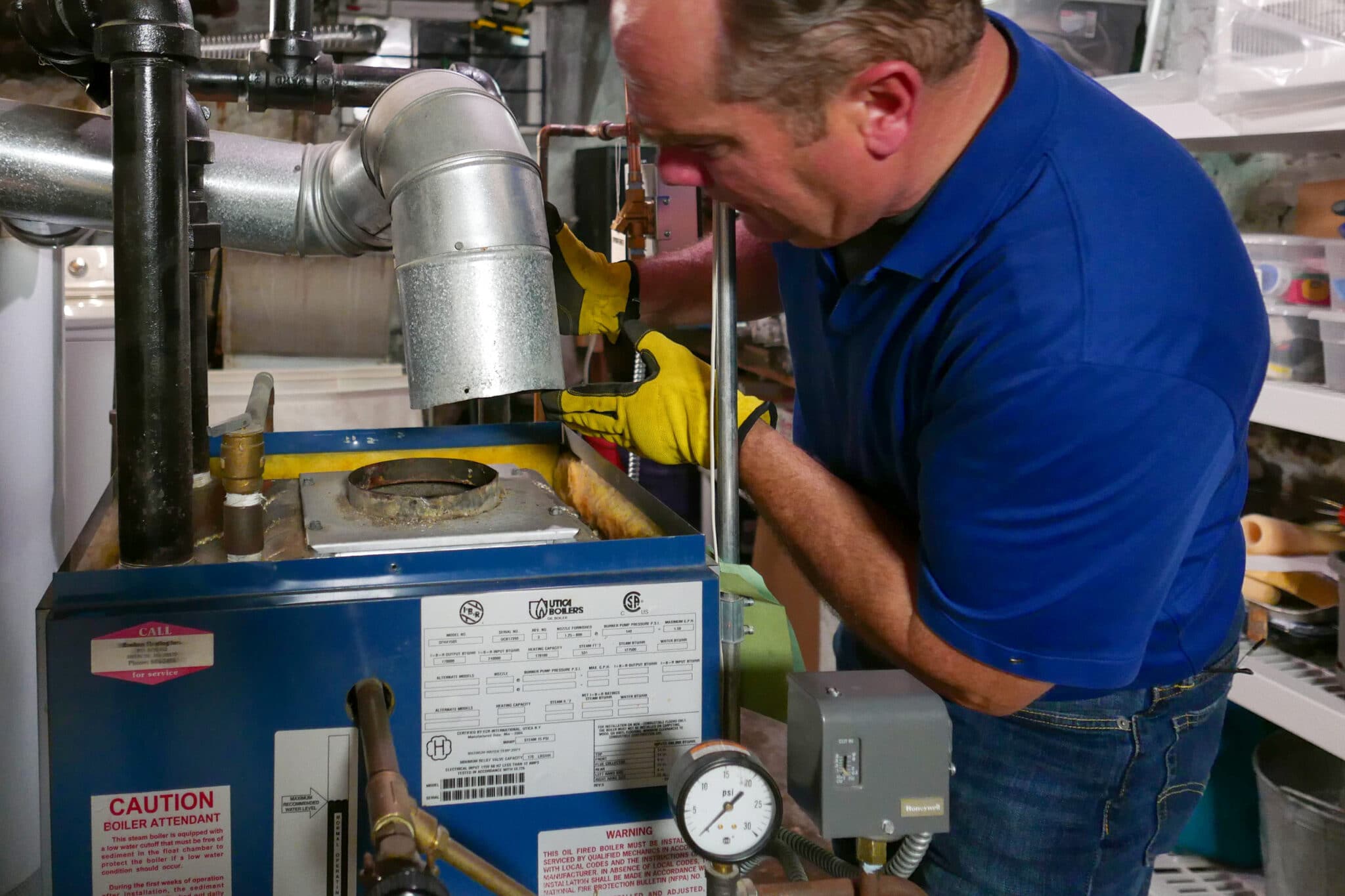 Man repairing a broken boiler