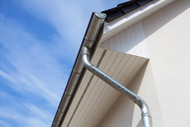 Rain gutter or Eavestrough with downspout maked of steel galvanized.