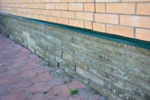 Side of house with serious foundation damage.