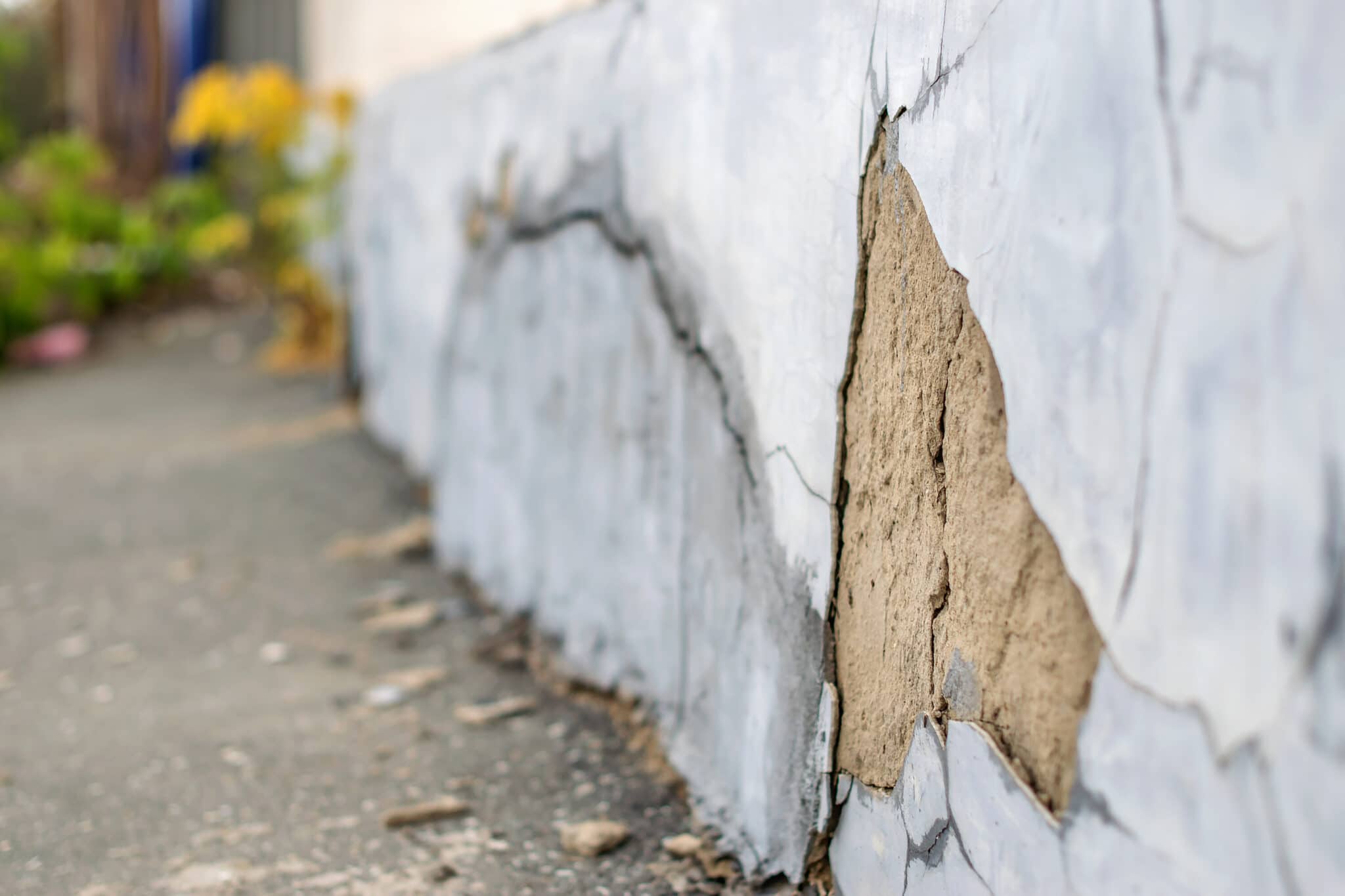 Cracks and chips on the ruined foundation of the old building structure