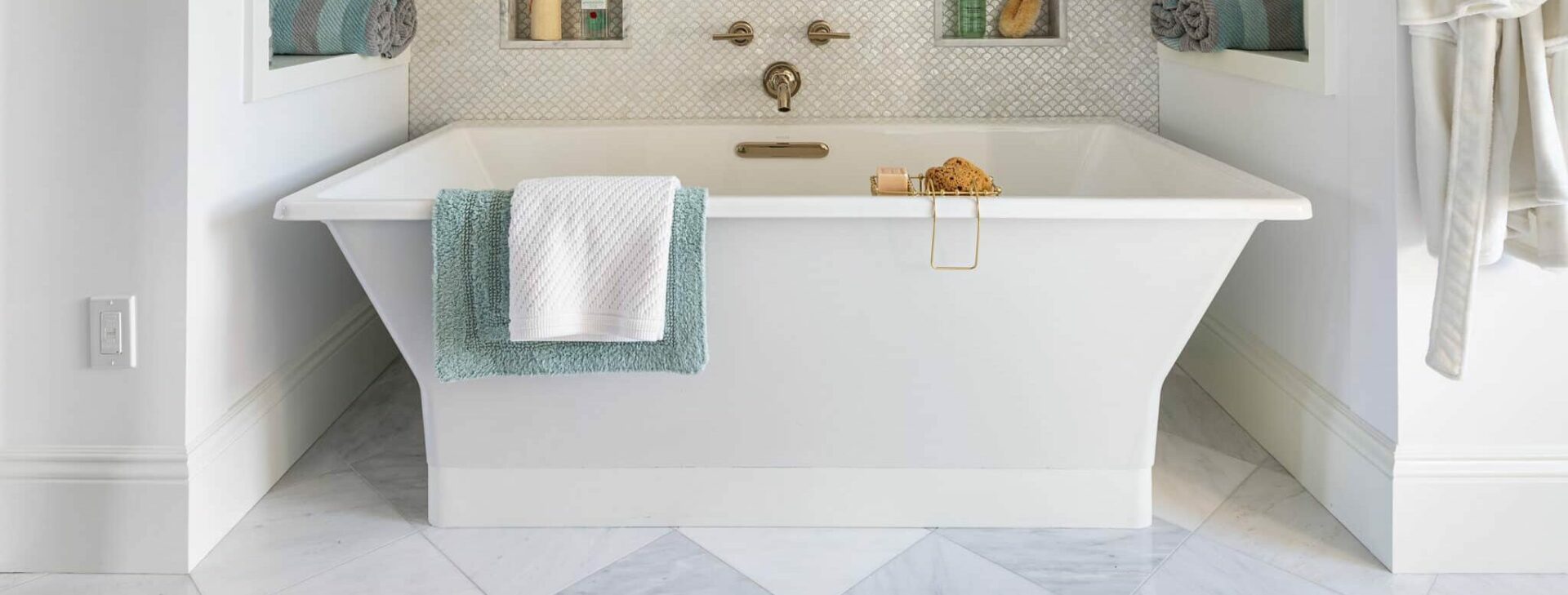 luxury bathroom with a beautiful bathtub on a tile floor