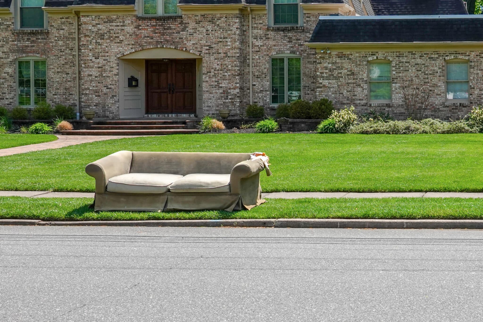 Couch on the side of the road for junk removal