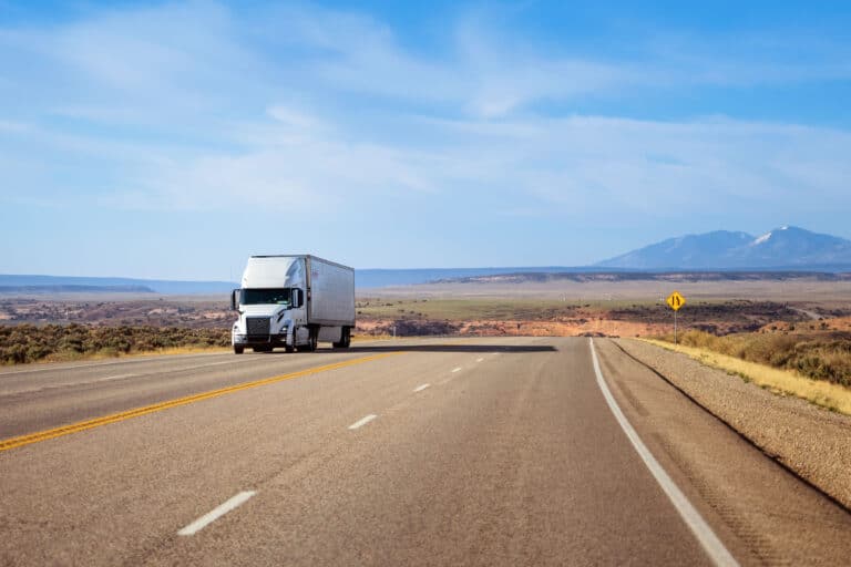 16 wheeler white semi moving truck transferingmerchandising in Utah, USA