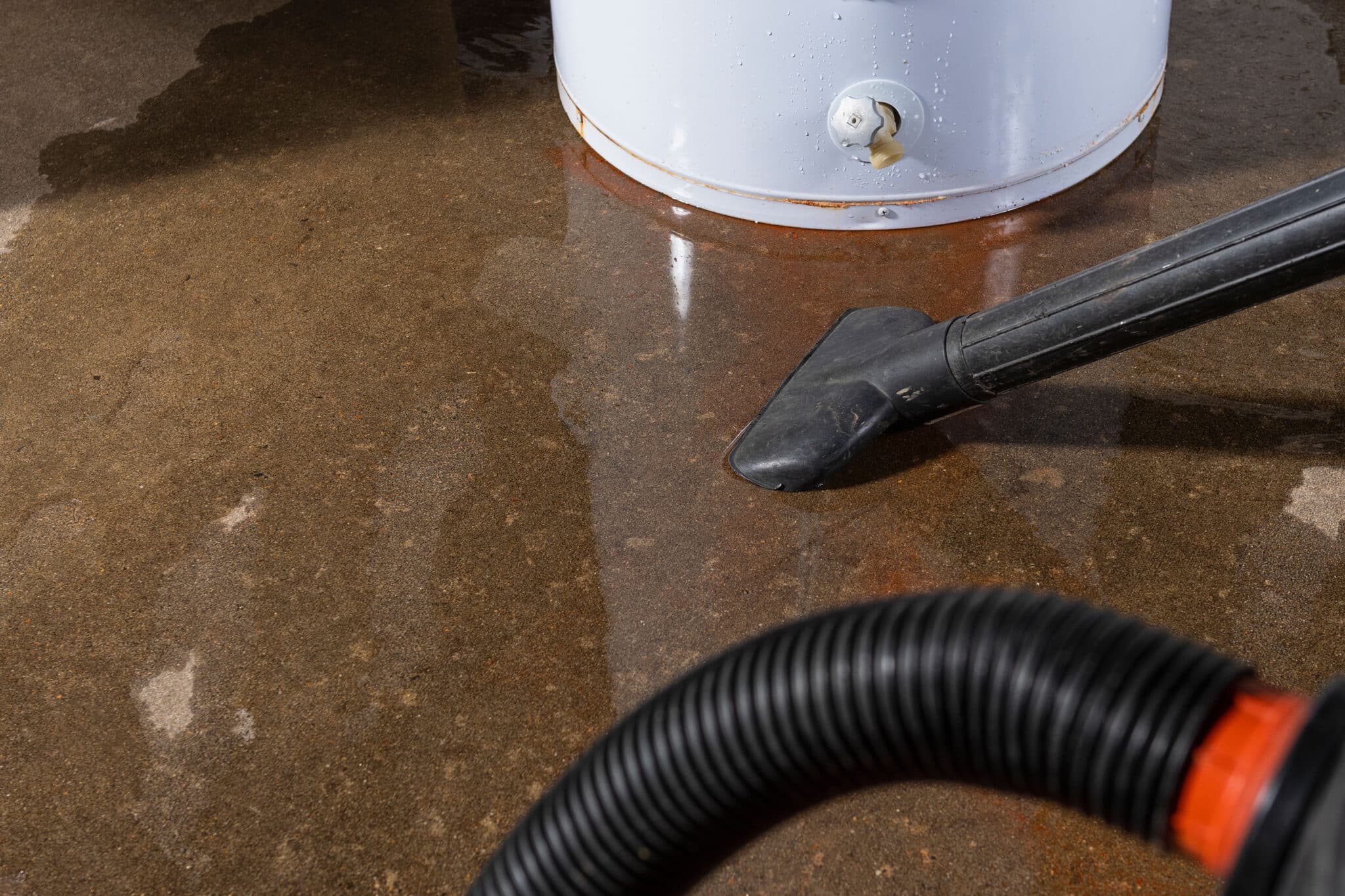 Vacuuming up water from a leaking residential domestic water heater