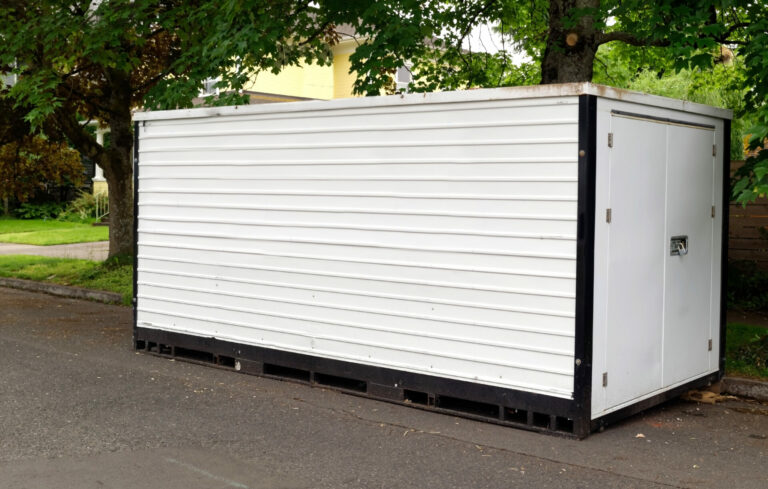 white storage container on residential street