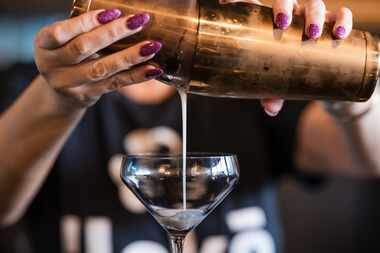 Alisha McCasland, the general manager of ˈLəkē in Dallas' Bishop Arts District, pours a Rose...