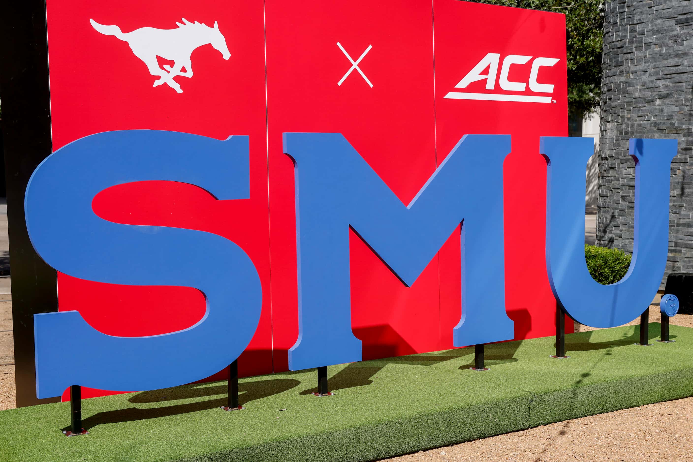 A SMU and ACC sign is seen during a celebration of SMU’s first day in the ACC at Happiest...