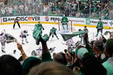 Fans cheer in the third period during Game 1 of the NHL hockey Stanley Cup Western...