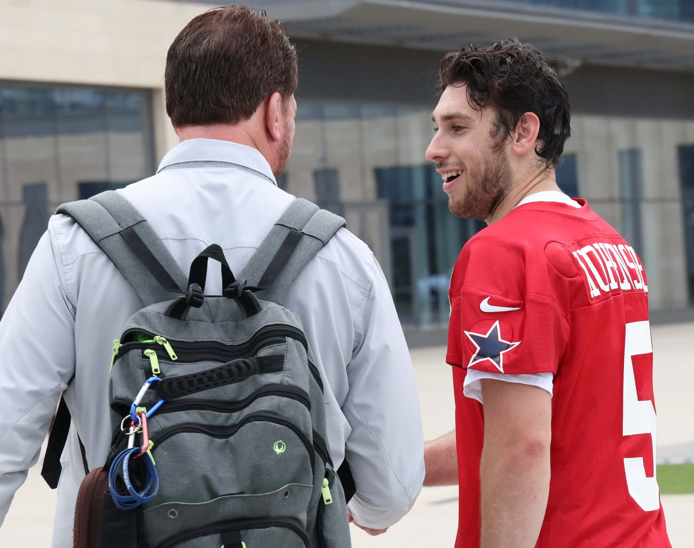 Dallas Cowboys quarterback Mike Hohensee (5) converses with former Cowboys quarterback Babe...