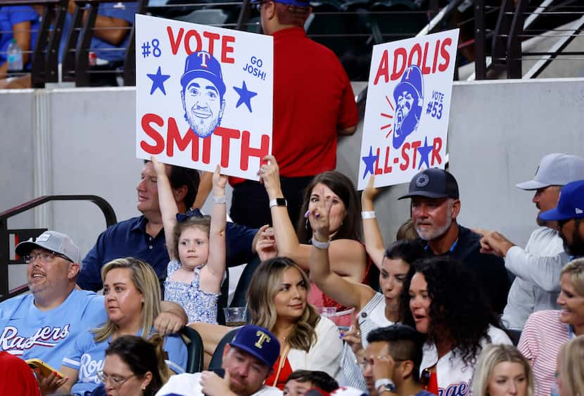 Young Texas Rangers fans encourage others to vote third baseman Josh Smith and outfielder...