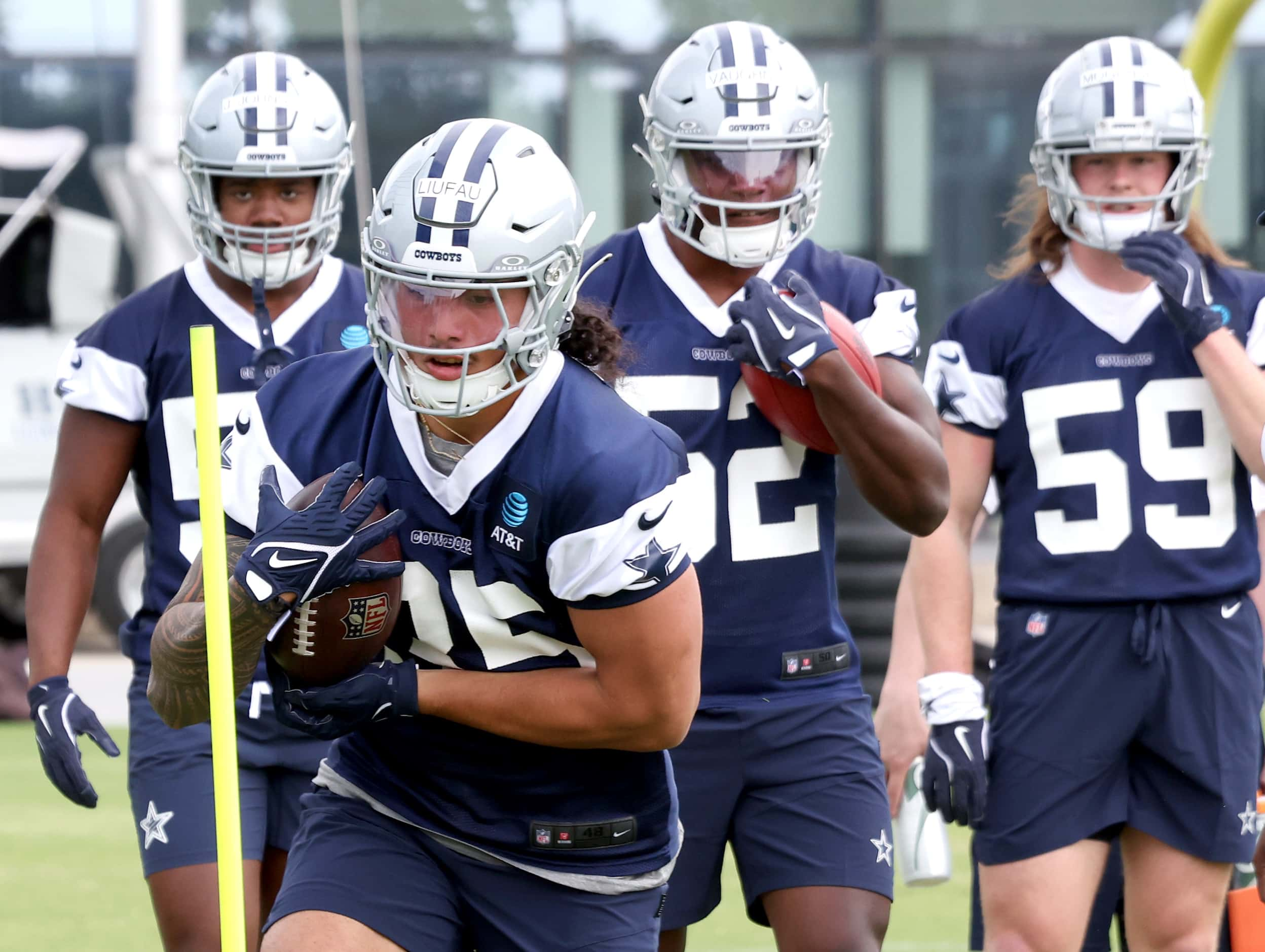 Dallas Cowboys linebacker Marist Liufau (35) works his way through a running drill as other...