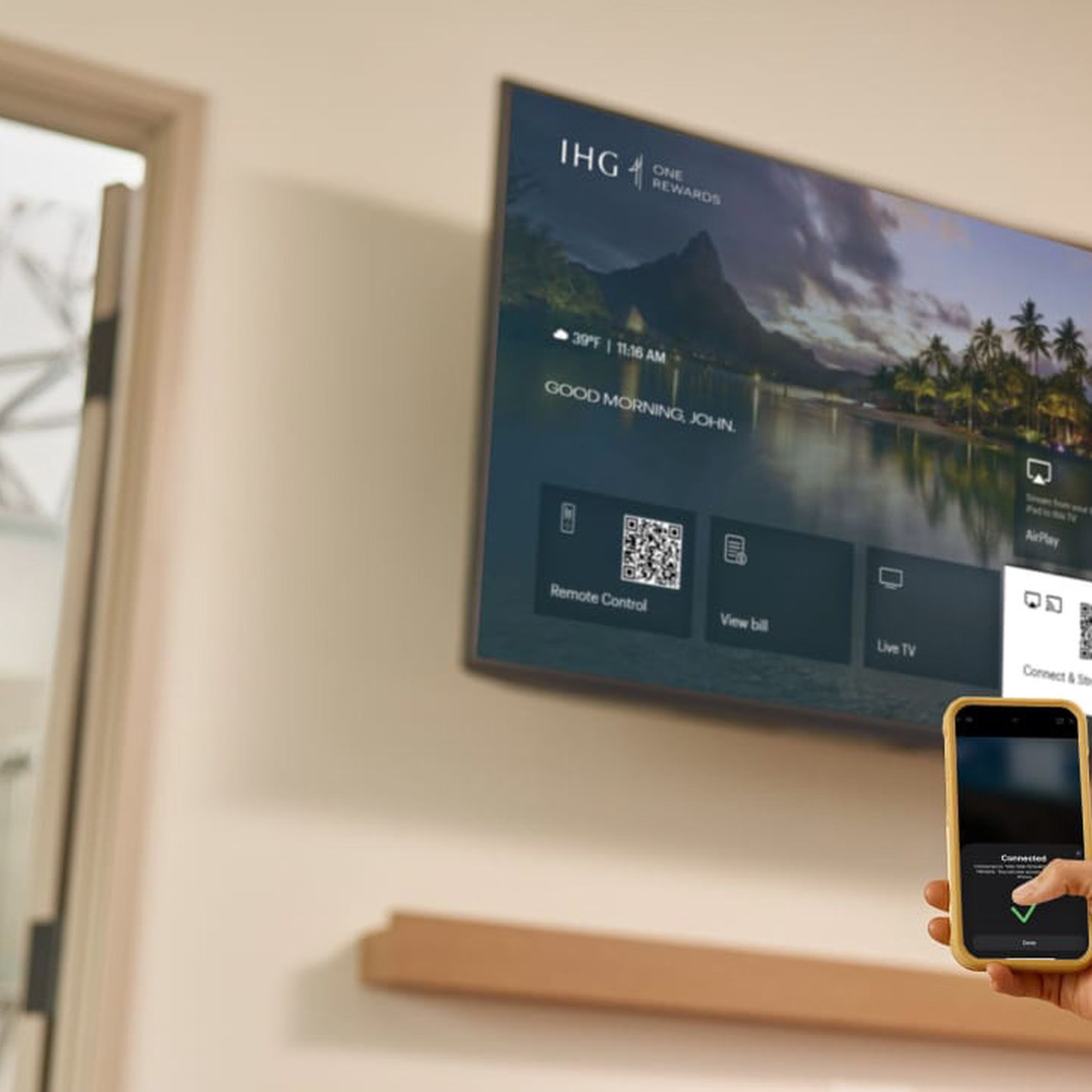 A photo showing someone using AirPlay in a hotel room